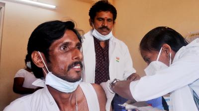 Staff of Government ENT Hospital gets administered with COVID Vaccine during the vaccination drive at the Hospital premises in Visakhapatnam. (DC Image/P Narasimha Murthy)