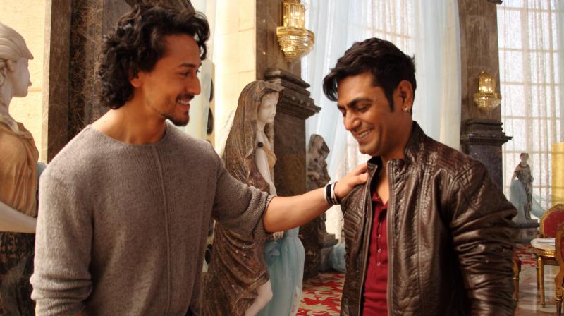 Tiger and Nawazuddin share a light moment while filming 'Munna Michael'. Tiger and Nawazuddin share a light moment while filming 'Munna Michael'.