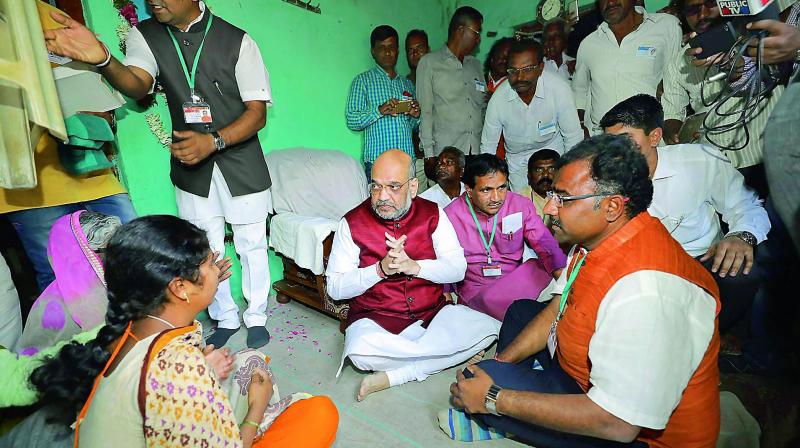 BJP national president Amit Shah visits the house of a farmer, Shivaraj Basalingappa Alreddy, who committed suicide at Mangalgi Village, in Bidar on Sunday. (Photo: PTI) BJP national president Amit Shah visits the house of a farmer, Shivaraj Basalingappa Alreddy, who committed suicide at Mangalgi Village, in Bidar on Sunday. (Photo: PTI)
