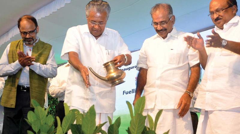 Chief Minister Pinarayi Vijayan launches first CNG fuel station at Kalamassery by watering saplings instead of lighting a traditional lamp on Thursday. IOC chief general Manager (Kerala) P.S Mony , transport minister A.K. Saseendran and Prof K.V Thomas, MP, are also seen. (Photo: SUNOJ NINAN MATHEW) Chief Minister Pinarayi Vijayan launches first CNG fuel station at Kalamassery by watering saplings instead of lighting a traditional lamp on Thursday. IOC chief general Manager (Kerala) P.S Mony , transport minister A.K. Saseendran and Prof K.V Thomas, MP, are also seen. (Photo: SUNOJ NINAN MATHEW)