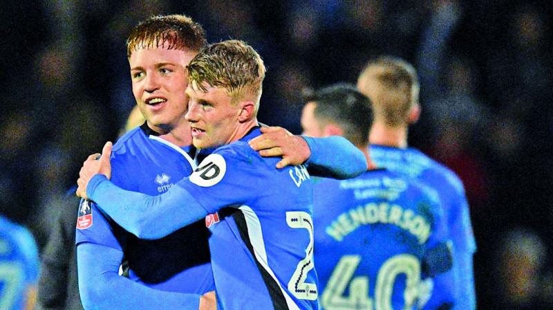 Rochdale’s Oliver Rathbone (left) and Andy Cannon after the 2-2 draw against Tottenham in their FA Cup fifth round match in Rochdale on Sunday. (Photo: AFP) Rochdale’s Oliver Rathbone (left) and Andy Cannon after the 2-2 draw against Tottenham in their FA Cup fifth round match in Rochdale on Sunday. (Photo: AFP)