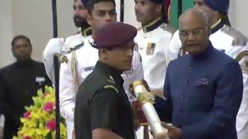 Exactly seven years after lighting up the Mumbai skyline with an unforgettable six, Mahendra Singh Dhoni again became the cynosure of all eyes as the honorary Lieutenant Colonel received the Padma Bhushan Award, dressed in an army uniform. (Photo: Twitter / ANI) Exactly seven years after lighting up the Mumbai skyline with an unforgettable six, Mahendra Singh Dhoni again became the cynosure of all eyes as the honorary Lieutenant Colonel received the Padma Bhushan Award, dressed in an army uniform. (Photo: Twitter / ANI)