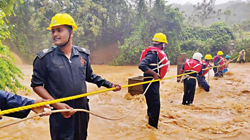 Rescue operation under way in one of the flood-hit villages in Kodagu on Friday (Photo: DC) Rescue operation under way in one of the flood-hit villages in Kodagu on Friday (Photo: DC)