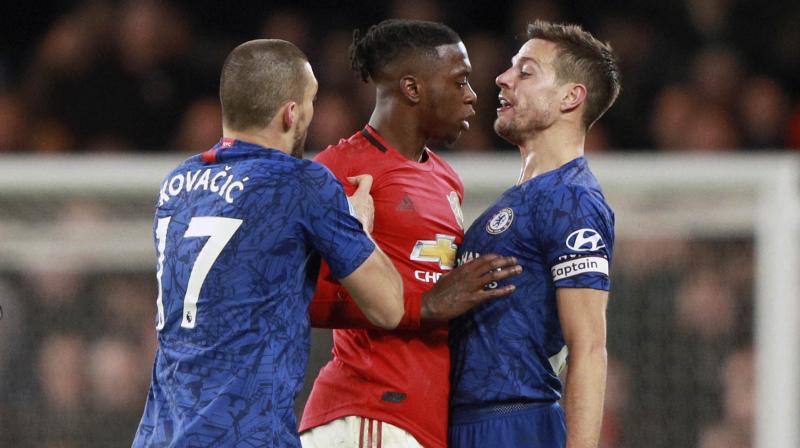 Chelsea have said they will ban a  large group  of Manchester United supporters who made homophobic chants at Mondays Premier League match at Stamford Bridge.