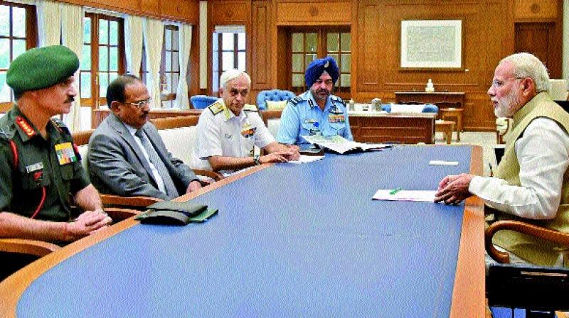 Prime Minister Narendra Modi in a meeting with the heads of the security forces in New Delhi on Tuesday. (Photo:PTI) Prime Minister Narendra Modi in a meeting with the heads of the security forces in New Delhi on Tuesday. (Photo:PTI)