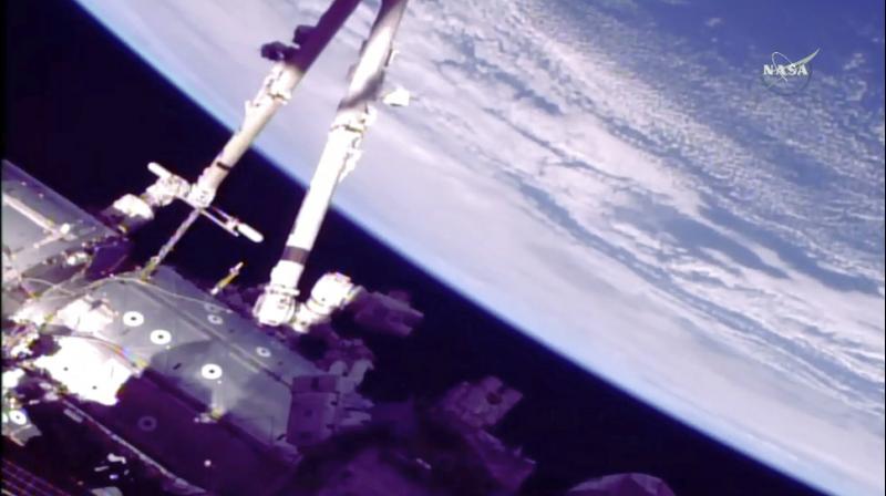 NASA astronaut Mark Vande Hei and Japan's Norishige Kanai quickly moved one of those old hands to a long-term storage location outside, and took the other one inside so it can be returned to Earth for a tuneup and then flown back up. NASA astronaut Mark Vande Hei and Japan's Norishige Kanai quickly moved one of those old hands to a long-term storage location outside, and took the other one inside so it can be returned to Earth for a tuneup and then flown back up.
