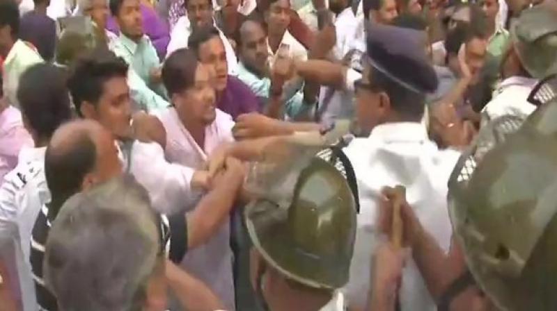A clash erupted between the Congress workers and police in Kolkata on Friday as the party staged a protest over rotten meat supply racket. (Photo: ANI) A clash erupted between the Congress workers and police in Kolkata on Friday as the party staged a protest over rotten meat supply racket. (Photo: ANI)