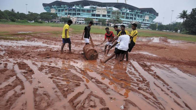 St. Albert's College players pull a roller on the college ground in the vicinity of the Jawaharlal Nehru Stadium that turned slushy after being used for parking during the ISL matches in Kochi, on Thursday. (Photo: DC) St. Albert's College players pull a roller on the college ground in the vicinity of the Jawaharlal Nehru Stadium that turned slushy after being used for parking during the ISL matches in Kochi, on Thursday. (Photo: DC)