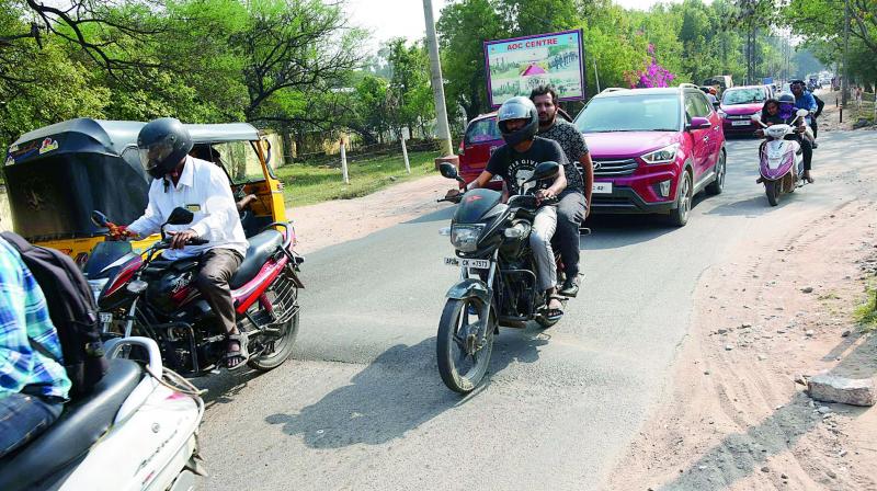 People commuting on the Marredpally-RK Puram road where the speed breakers are not even painted with black and white stripes. — DC People commuting on the Marredpally-RK Puram road where the speed breakers are not even painted with black and white stripes. — DC