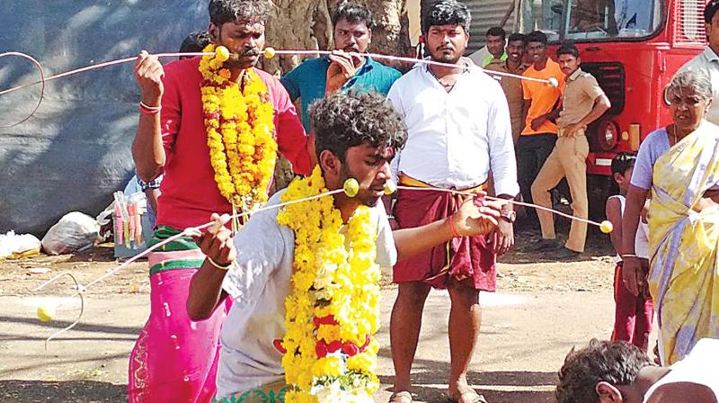 Shops, eateries, giant wheels and other entertainment for children, devotees carrying kumbam, and some piercing their cheeks with metal skewers as part of the festival related devotional acts, enacted a perfect village festival atmosphere inside the woods. Shops, eateries, giant wheels and other entertainment for children, devotees carrying kumbam, and some piercing their cheeks with metal skewers as part of the festival related devotional acts, enacted a perfect village festival atmosphere inside the woods.