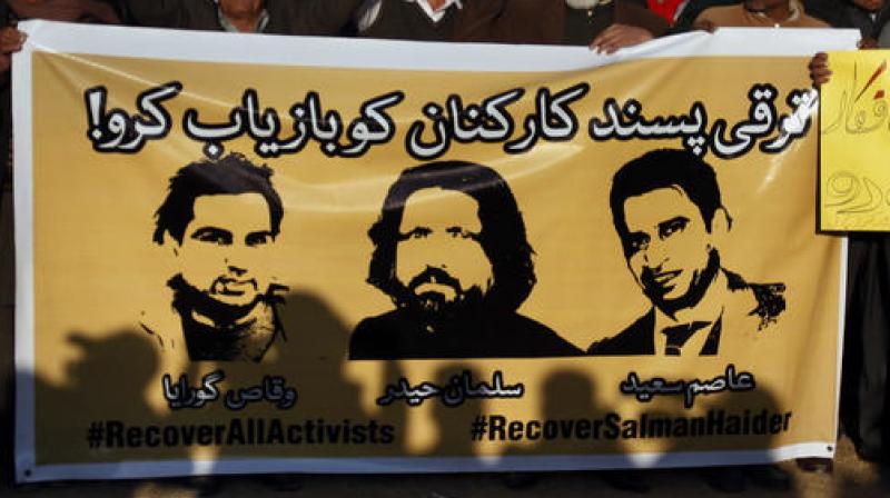 In this Jan. 10, 2017 photo, members of civil society hold a banner with pictures of missing rights activists, Waqas Goraya, Salman Haider, and Asim Saeed, during a demonstration to condemn the missing human rights activists, in Islamabad. (Photo: AP) In this Jan. 10, 2017 photo, members of civil society hold a banner with pictures of missing rights activists, Waqas Goraya, Salman Haider, and Asim Saeed, during a demonstration to condemn the missing human rights activists, in Islamabad. (Photo: AP)