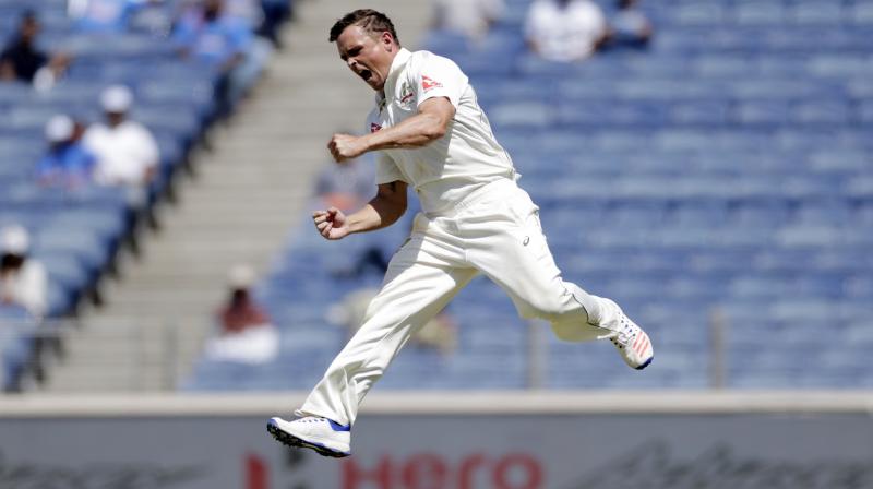 Australias left arm spinner Steve OKeefe celebrates Virat Kohlis wicket during the Pune Test in 2017. AP Photo