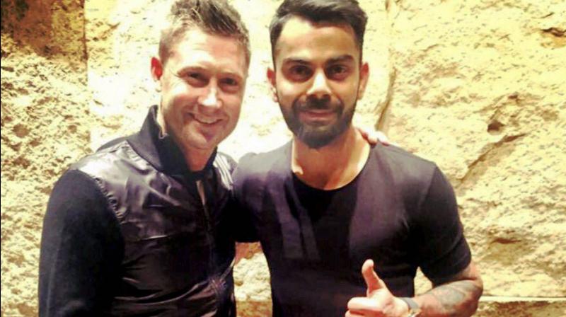 Former Australian skipper Michael Clarke with Indian captain Virat Kohli in Bengaluru three years ago. PTI Photo Former Australian skipper Michael Clarke with Indian captain Virat Kohli in Bengaluru three years ago. PTI Photo