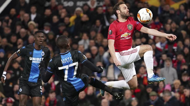 Manchester United's Juan Mata (R) controls the ball ahead of Brugge's Clinton Mata during the round of 32 second leg Europa League match at Old Trafford in Manchester, England, on Feb. 27, 2020. AP Photo Manchester United's Juan Mata (R) controls the ball ahead of Brugge's Clinton Mata during the round of 32 second leg Europa League match at Old Trafford in Manchester, England, on Feb. 27, 2020. AP Photo