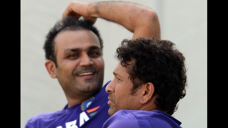 ndian cricketers Virender Sehwag and Sachin Tendulkar. AFP Photo