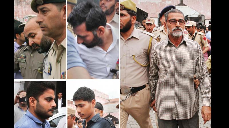 Prime accused Sanji Ram (R) and other accused in Kathua rape and murder case being produced in district court on Monday. (Photo: PTI ) Prime accused Sanji Ram (R) and other accused in Kathua rape and murder case being produced in district court on Monday. (Photo: PTI )