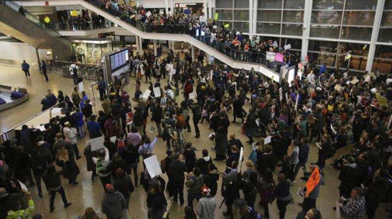 More than 1,000 people gather at Seattle-Tacoma International Airport, to protest President Donald Trump's order that restricts immigration to the U.S. (Photo: AP) More than 1,000 people gather at Seattle-Tacoma International Airport, to protest President Donald Trump's order that restricts immigration to the U.S. (Photo: AP)