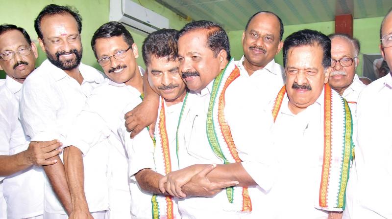 UDF candidate for Konni P. Mohanraj hugs Adoor Prakash, MP, when he arrived at the election convention at Konni. Leader of opposition Ramesh Chennithala is also seen. UDF candidate for Konni P. Mohanraj hugs Adoor Prakash, MP, when he arrived at the election convention at Konni. Leader of opposition Ramesh Chennithala is also seen.