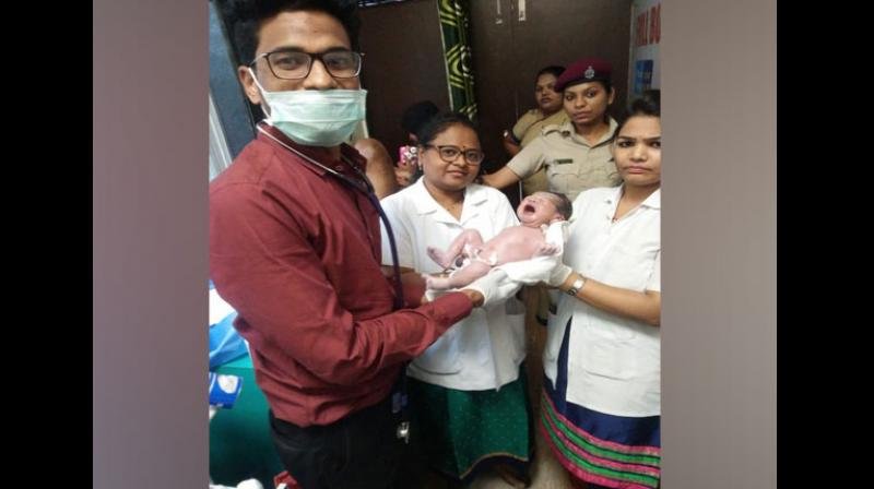 A woman delivered a baby boy at Thane railway station on Saturday evening after she developed labour pain while travelling to Kurla. (Photo: ANI) A woman delivered a baby boy at Thane railway station on Saturday evening after she developed labour pain while travelling to Kurla. (Photo: ANI)