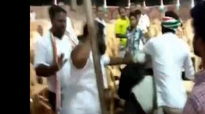 Enraged with the lensmen, a few congress party workers misbehaved with photojournalists and began to thrash them. (Photo: ANI) Enraged with the lensmen, a few congress party workers misbehaved with photojournalists and began to thrash them. (Photo: ANI)