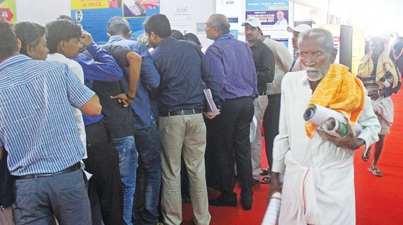Visitors at the inauguration of Digi Dhan Mela at Jnana Jyothi auditorium in Bengaluru on Monday. (Photo: DC) Visitors at the inauguration of Digi Dhan Mela at Jnana Jyothi auditorium in Bengaluru on Monday. (Photo: DC)