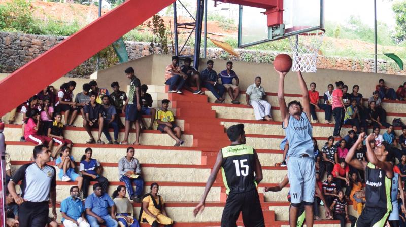 Sajeesh scores for Kottayam against Alappuzha in a boys' group match in the state junior basketball championship at Thodupuzha. Sajeesh scores for Kottayam against Alappuzha in a boys' group match in the state junior basketball championship at Thodupuzha.
