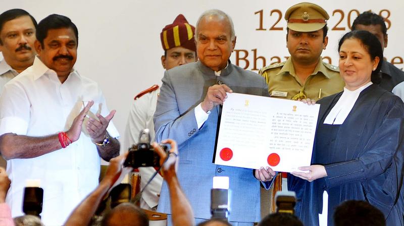 Governor Banwarilal Purohit and the new Chief Justice of Madras high court Vijaya Kamlesh Tahilramani with the latter’s Warrant of Appointment during the swearing-in ceremony in Raj Bhavan on Sunday. Also seen is Chief Minister Edappadi K. Palaniswami. (Photo:DC) Governor Banwarilal Purohit and the new Chief Justice of Madras high court Vijaya Kamlesh Tahilramani with the latter’s Warrant of Appointment during the swearing-in ceremony in Raj Bhavan on Sunday. Also seen is Chief Minister Edappadi K. Palaniswami. (Photo:DC)
