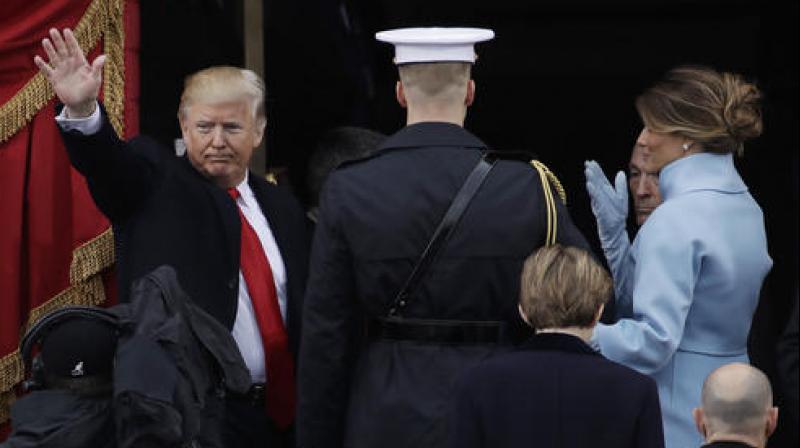 President Donald Trump waves with his wife Melania Trump after being sworn in as the 45th president of the United States during the 58th Presidential Inauguration at the U.S. Capitol in Washington. (Photo: AP) President Donald Trump waves with his wife Melania Trump after being sworn in as the 45th president of the United States during the 58th Presidential Inauguration at the U.S. Capitol in Washington. (Photo: AP)