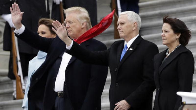 President Donald Trump and first lady Melania Trump along with Vice President Mike Pence and his wife Karen wave to former President Barack Obama during a departure ceremony on the East Front of the U.S. Capitol in Washington. (Photo: AP) President Donald Trump and first lady Melania Trump along with Vice President Mike Pence and his wife Karen wave to former President Barack Obama during a departure ceremony on the East Front of the U.S. Capitol in Washington. (Photo: AP)