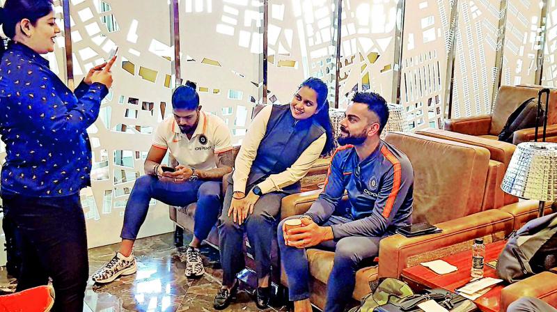 India captain Virat Kohli poses with a fan at the Mumbai airport. India captain Virat Kohli poses with a fan at the Mumbai airport.