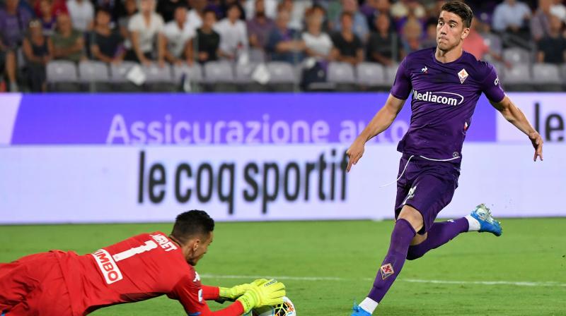 In this file photo Napoli's Italian goalkeeper Alex Meret (L) saves a shot from Fiorentina's Serbian forward Dusan Vlahovic during a Italian Serie A match at the Artemio-Franchi stadium in Florence. Some celebrities around the world are affected by the novel coronavirus such as Fiorentina's Serbian forward Dusan Vlahovic. He has been tested positive for Covid-19. AFP Photo In this file photo Napoli's Italian goalkeeper Alex Meret (L) saves a shot from Fiorentina's Serbian forward Dusan Vlahovic during a Italian Serie A match at the Artemio-Franchi stadium in Florence. Some celebrities around the world are affected by the novel coronavirus such as Fiorentina's Serbian forward Dusan Vlahovic. He has been tested positive for Covid-19. AFP Photo