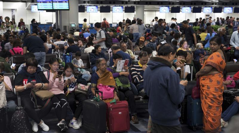 Passengers stranded at the Hong Kong International airport. AP Photo Passengers stranded at the Hong Kong International airport. AP Photo