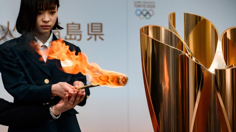 The Tokyo 2020 Olympic flame is displayed outside Fukushima railway station in Fukushima Prefecture. AFP Photo