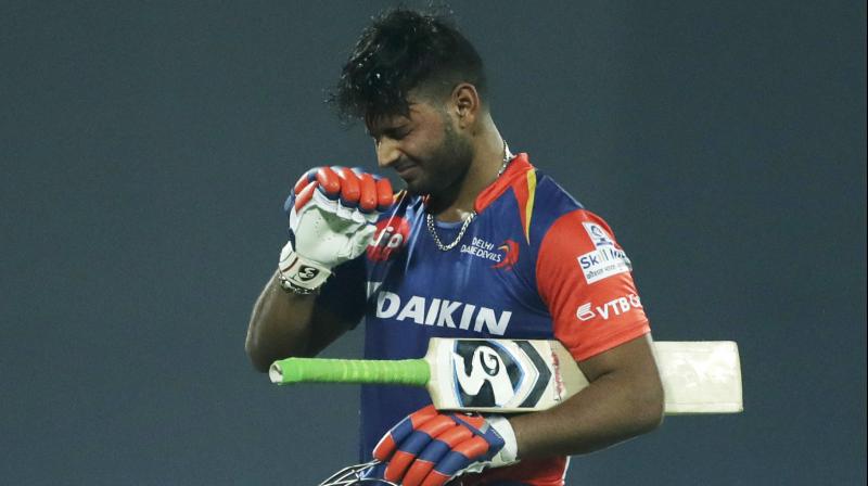 Rishabh Pant curses himself on way back to the hut. AP Photo Rishabh Pant curses himself on way back to the hut. AP Photo