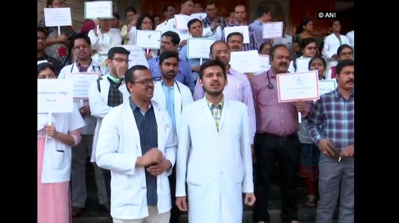 Following an allegation of a doctor being physically assaulted by patient's relatives, junior doctors of Gandhi Hospital here continued their protest on Thursday over the safety and security of the doctors. (Photo: ANI) Following an allegation of a doctor being physically assaulted by patient's relatives, junior doctors of Gandhi Hospital here continued their protest on Thursday over the safety and security of the doctors. (Photo: ANI)