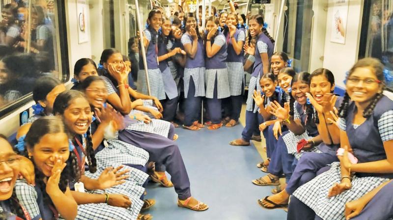 Students enjoying a ride on metro. Students enjoying a ride on metro.