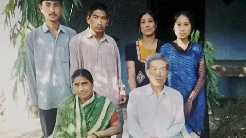Wang Qi, a Chinese prisoner of war who settled in Madhya Pradesh's Balaghat district, with his family. (Photo: PTI) Wang Qi, a Chinese prisoner of war who settled in Madhya Pradesh's Balaghat district, with his family. (Photo: PTI)