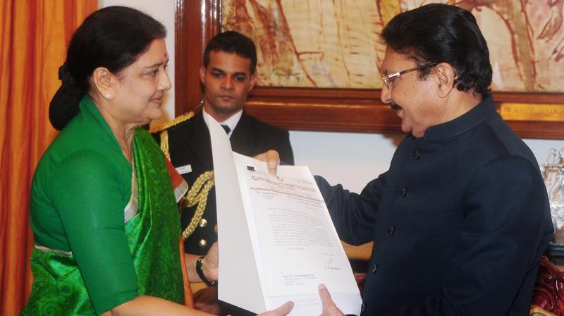AIADMK General Secretary VK Sasikala presenting the letter of presumably the MLAs support to her candidate to stake claim during the meeting with Tamil Nadu Governor CH Vidyasagar Rao at Raj Bhavan in Chennai. (Photo: PTI) AIADMK General Secretary VK Sasikala presenting the letter of presumably the MLAs support to her candidate to stake claim during the meeting with Tamil Nadu Governor CH Vidyasagar Rao at Raj Bhavan in Chennai. (Photo: PTI)