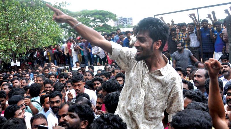 An excited Dileep fan gestures as he awaits the actor in front of Aluva sub-jail on Tuesday. (Photo: SUNOJ NINAN MATHEW) An excited Dileep fan gestures as he awaits the actor in front of Aluva sub-jail on Tuesday. (Photo: SUNOJ NINAN MATHEW)