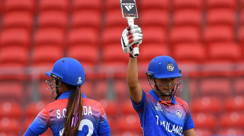 Thailands Natthakan Chantam celebrates her half century during the Twenty20 womens World Cup match against Pakistan in Sydney on Tuesday. AFP Photo