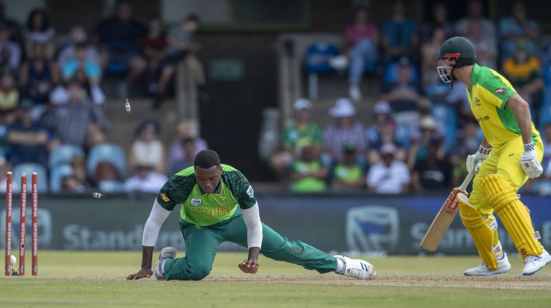 South Africas Lungi Ngidi attempts to field off his own bowling while Australias batsman Mitchell Marsh scrambles to make his ground during the 2nd One Day International at Managing Oval in Bloemfontein, South Africa, on Wednesday. AP Photo