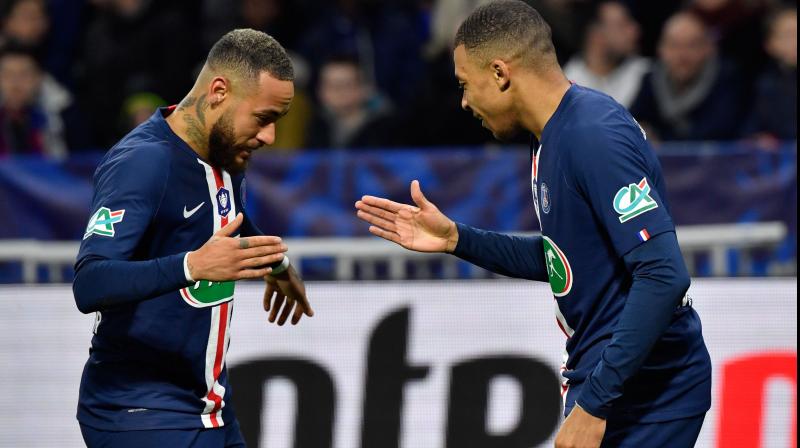 Paris Saint-Germains French forward Kylian Mbappe celebrates his goal with Brazilian striker Neymar during their French Cup gane against Olympique Lyonnais on Wednesday. AFP Photo