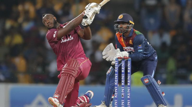 West Indies batsman Andre Russell hammers a delivery for maximum during the second and final T20 International in Pallekele, Sri Lanka, on Friday. AP Photo