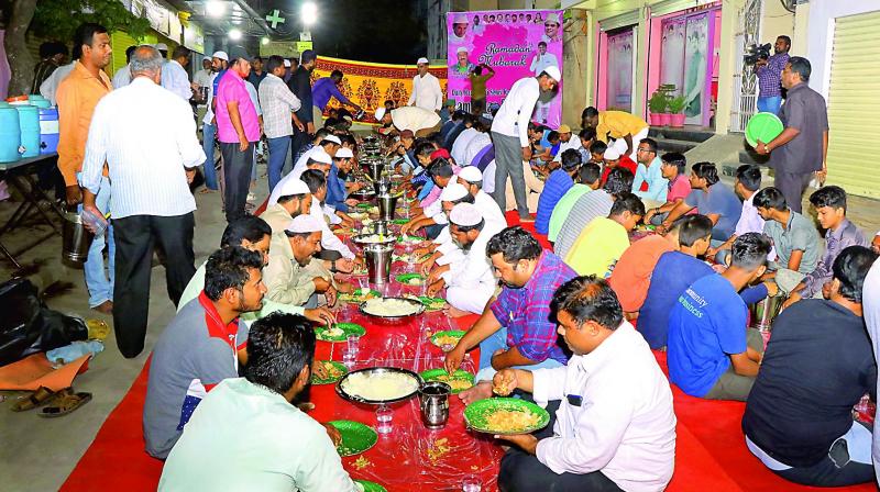 Members of the Humanity First Foundation serve food to the fasting people near Borabanda area in Hyderabad. Members of the Humanity First Foundation serve food to the fasting people near Borabanda area in Hyderabad.