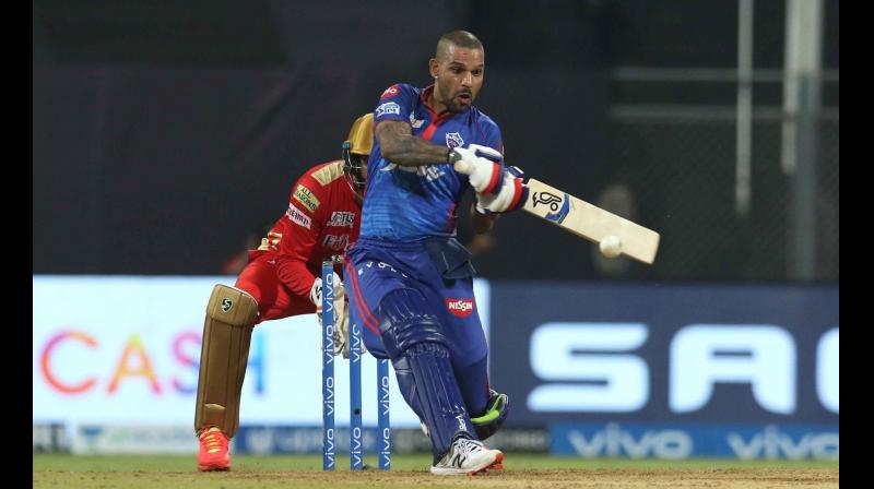 Delhi Capitals opener Shikhar Dhawan plays a shot during the match against Punjab Kings in the IPL on Sunday. 	 IPL