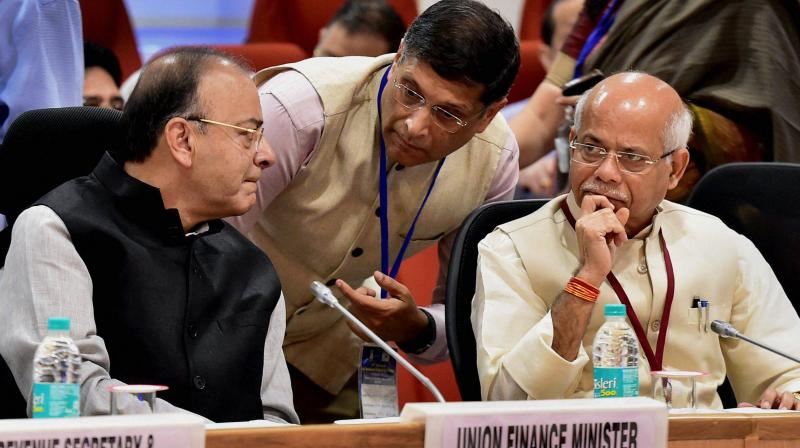Union finance minister Arun Jaitley listens to Chief economic advisor Arvind Subramaniam as minister of state for finance Shiv Pratap Shukla looks on, at the 22nd meeting of the GST council, in New Delhi on Friday. (Photo: PTI) Union finance minister Arun Jaitley listens to Chief economic advisor Arvind Subramaniam as minister of state for finance Shiv Pratap Shukla looks on, at the 22nd meeting of the GST council, in New Delhi on Friday. (Photo: PTI)
