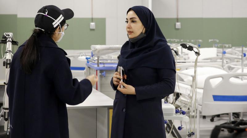 An Iranian health inspector checks a makeshift hospital set up inside the Iran Mall, northwest of Tehran, Iran.AFP Photo An Iranian health inspector checks a makeshift hospital set up inside the Iran Mall, northwest of Tehran, Iran.AFP Photo