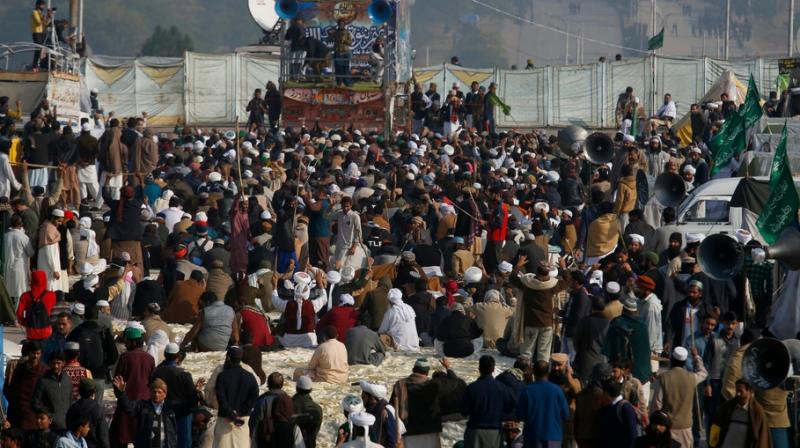 The protesters had staged sit-in in the capital for about three weeks demanding removal of Hamid for changes in a law related to the Khatm-i-Nabuwwat (finality of prohpethood) oath in the Elections Act 2017. (Photo: AP) The protesters had staged sit-in in the capital for about three weeks demanding removal of Hamid for changes in a law related to the Khatm-i-Nabuwwat (finality of prohpethood) oath in the Elections Act 2017. (Photo: AP)