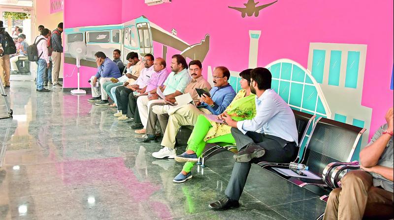 GHMC commissioner G. Janardhan Reddy (third from right) with other officials wait for K.T. Rama Rao for the inauguration of the bus stop at Hitec City on Tuesday. GHMC commissioner G. Janardhan Reddy (third from right) with other officials wait for K.T. Rama Rao for the inauguration of the bus stop at Hitec City on Tuesday.