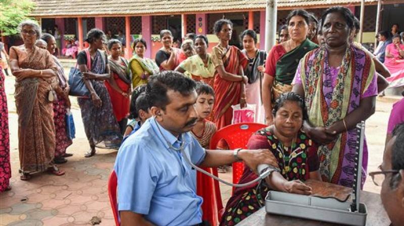 Flood affected people queue up for health check-up at a relief camp at North Paravoor in Kochi. (Photo: PTI) Flood affected people queue up for health check-up at a relief camp at North Paravoor in Kochi. (Photo: PTI)